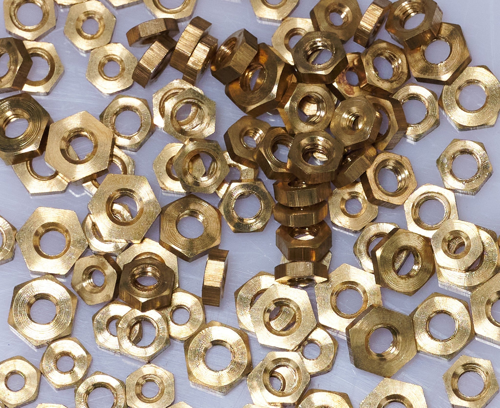 100 BRASS CLOCK NUTS ASSORTED clockmakers parts spares repairs 3-7mm movement
